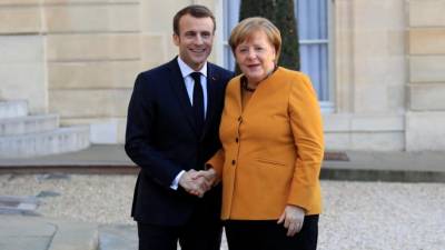 Macron e Merkel só admitem adiar Brexit se houver “nova perspectiva”