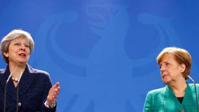 Merkel e May defendem acordo nuclear com o Irão