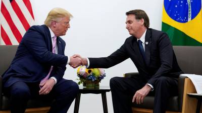Presidente dos EUA pede paciência perante a crise da Venezuela num encontro com Bolsonaro
