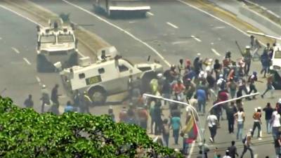 Simpatizantes de Maduro e de Guaidó preparam-se para medir forças nas ruas